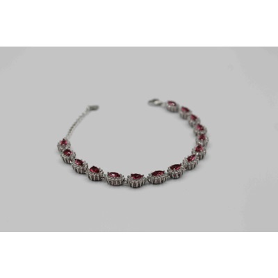 Beautiful bracelet with tear drop shaped and red and white zircons on the chain.