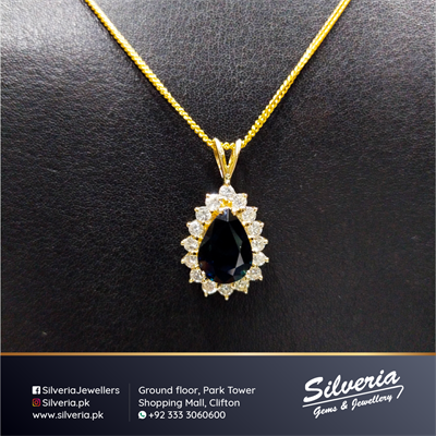3.51ct tear drop shaped Natural Australian Blue Sapphire Pendant with 0.85ct diamonds in 14kt Yellow Gold.