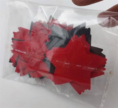 STELLAR CELEBRATION: 140 PACK OF RED, BLACK & GREEN STAR CUTOUTS (2 INCH SIZE)