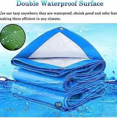 100% WATERPROOF PLASTIC BLUE/WHITE KOREAN TARPAL SIZE (24 ft X 30 ft) USED FOR SUNSHADE AND OTHER OUTDOOR ACTIVITIES.